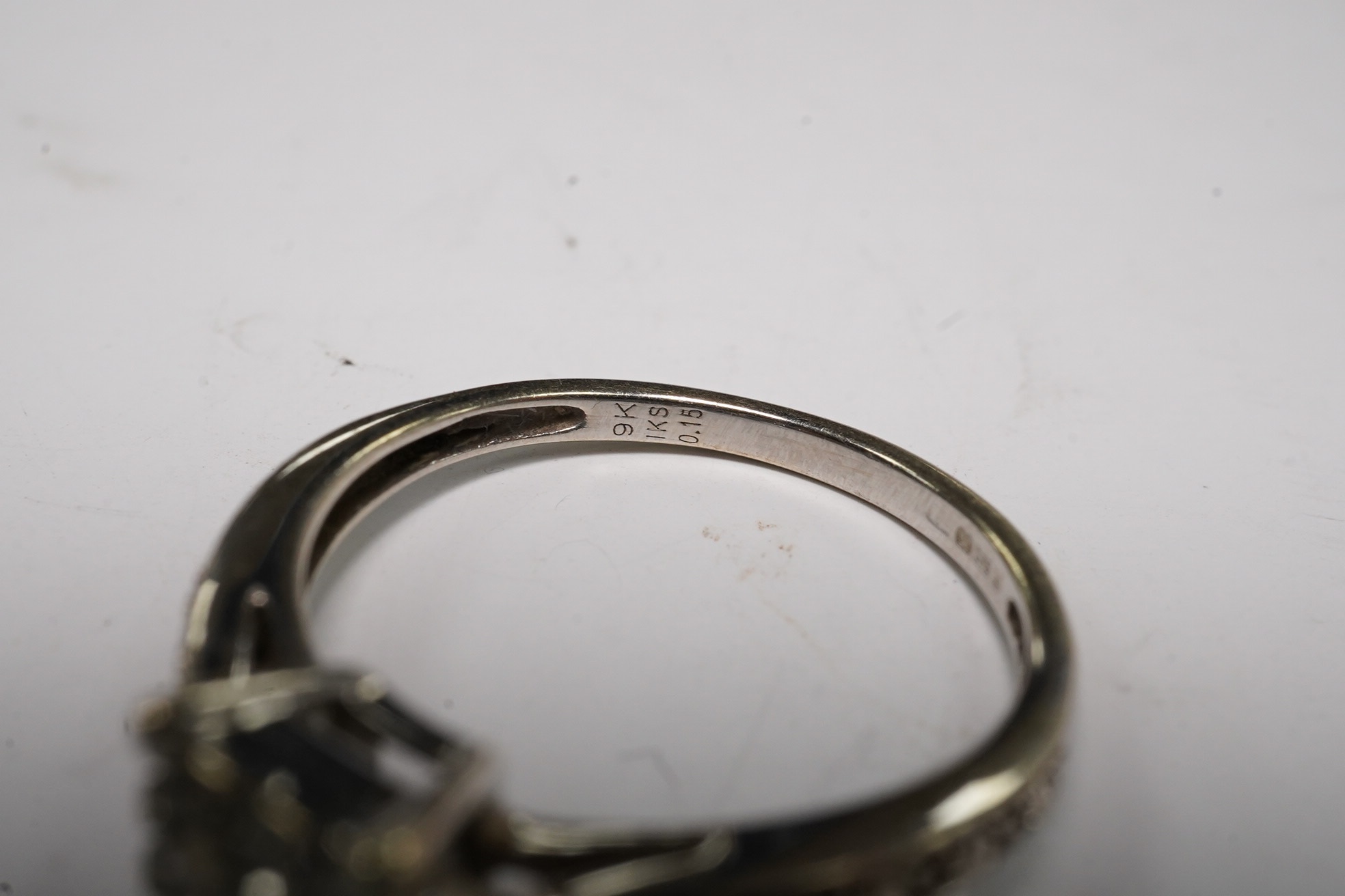 Two modern 9ct gold and diamond set rings, including square cluster and five stone half hoop, gross weight 4.2 grams.